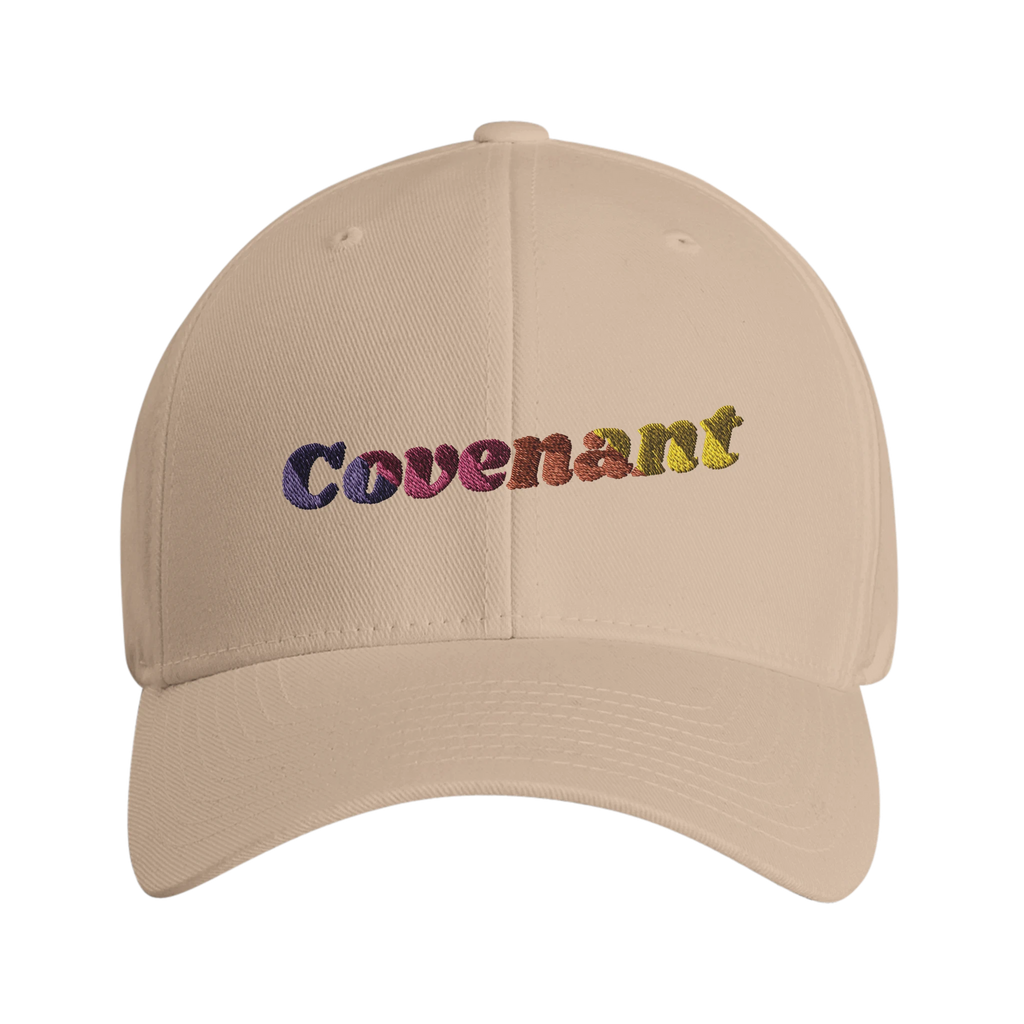 Beige 'Covenant' FlexFit hat with rainbow lettering that says 'Covenant'  - front view