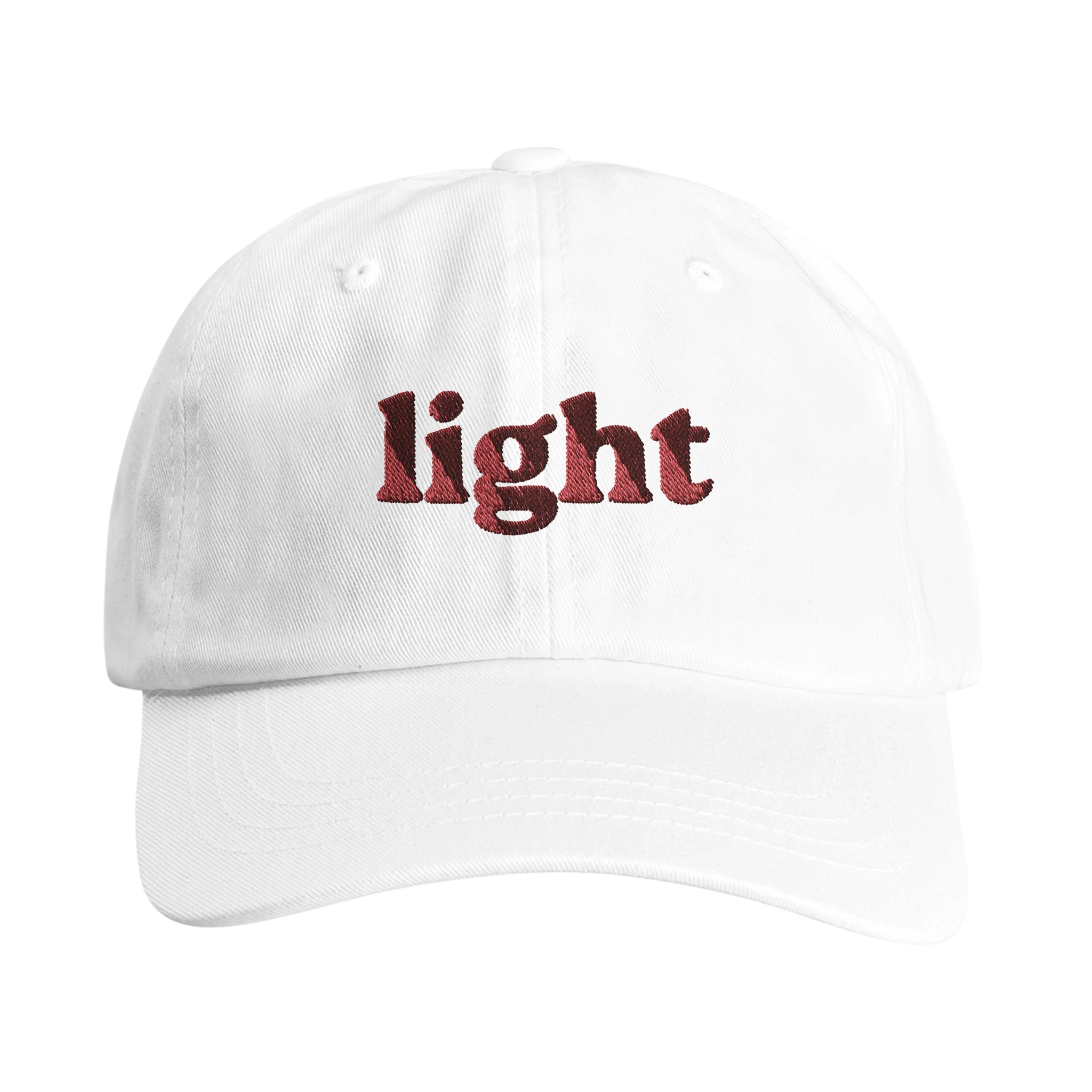 White Christian dad hat with red lettering reading The Light - Wearing Salvation
