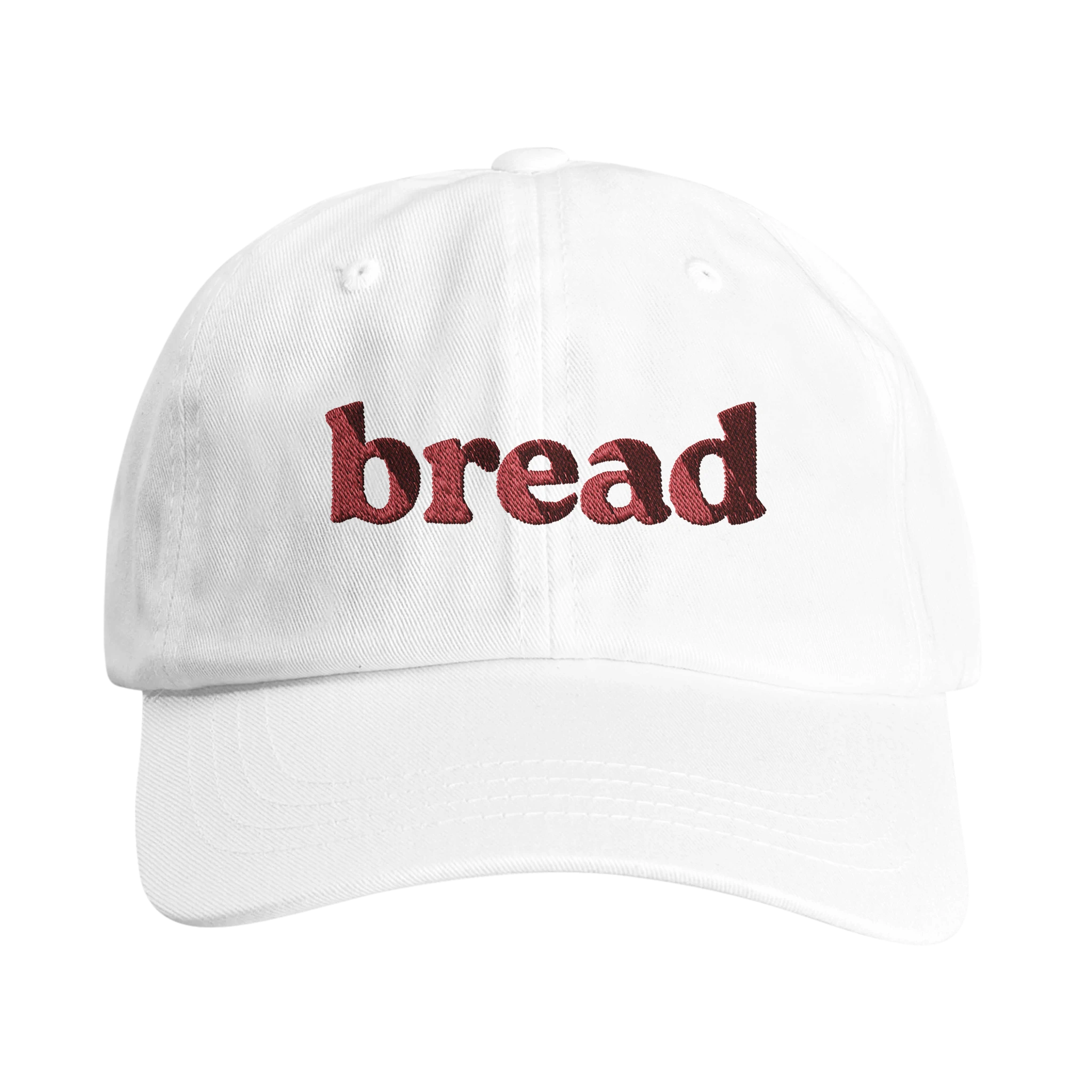 Front view white hat with red 'bread' embroidery symbolizing Bread of Life - Wearing Salvation