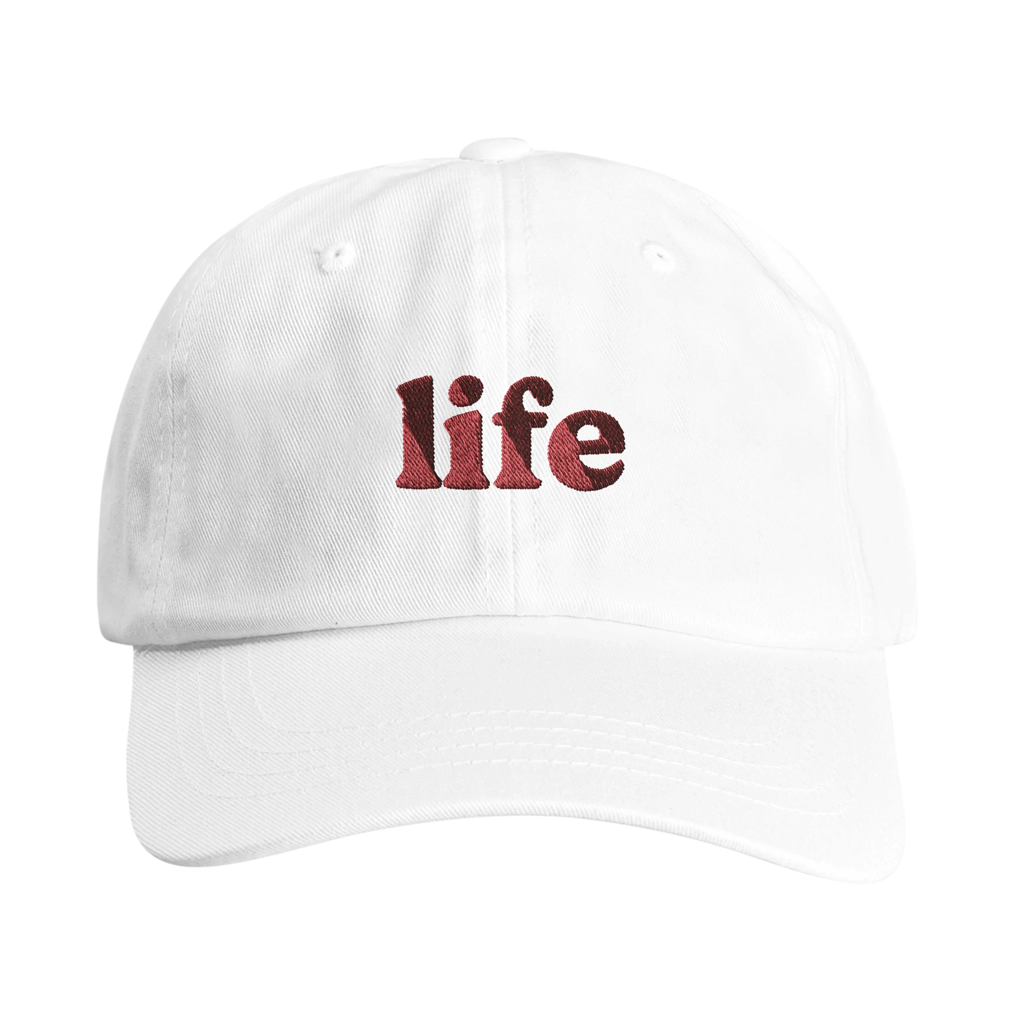 White Christian hat with red 'life' embroidery front- Wearing Salvation